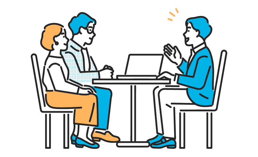 パソコンを前に打合せするビジネスマン